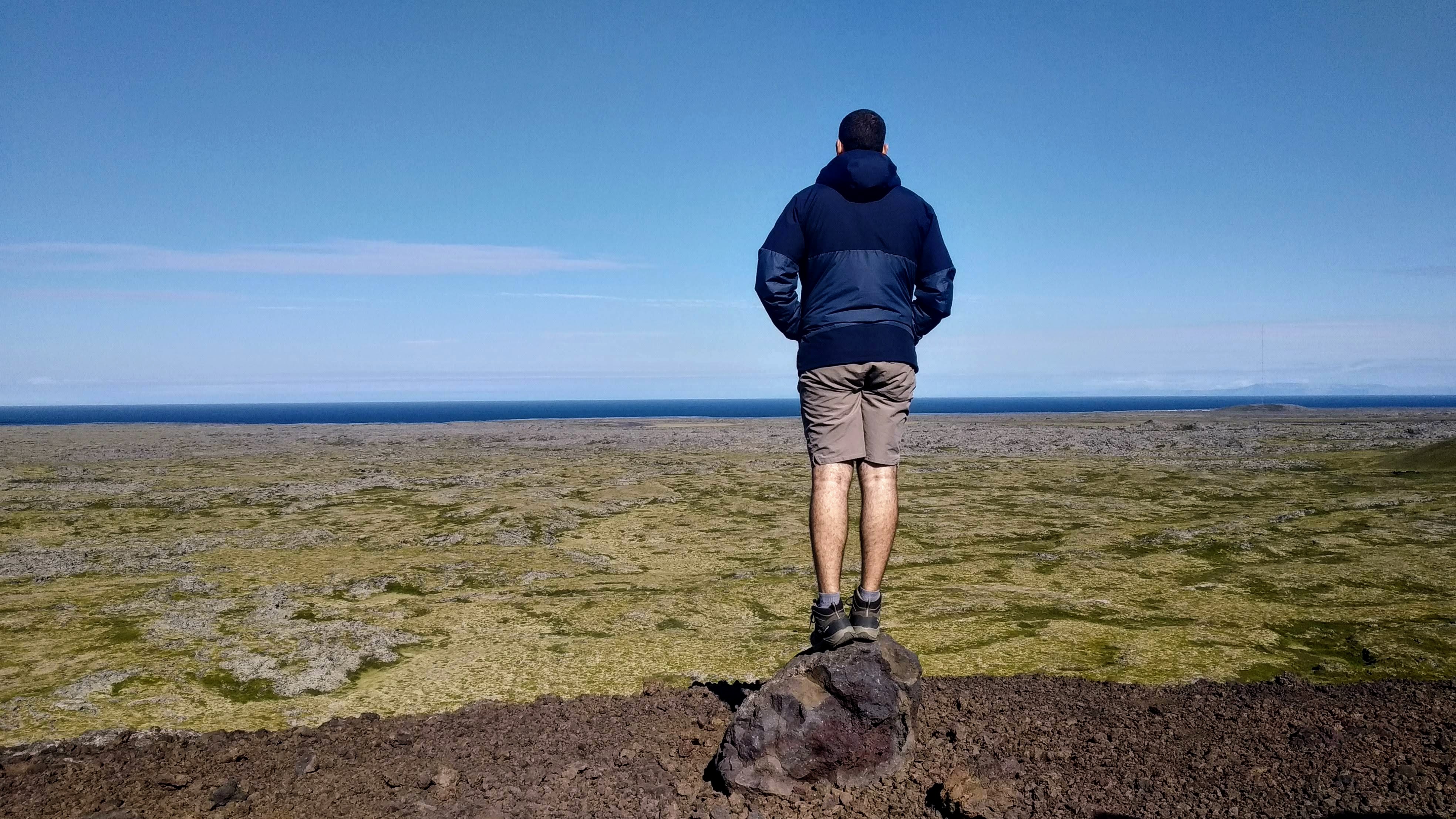 Saxhóll crater with view of the Atlantic Ocean is seen from the crater, with a dried lava field before